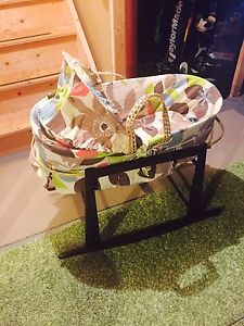 Moses basket with jolly jumper rocking stand