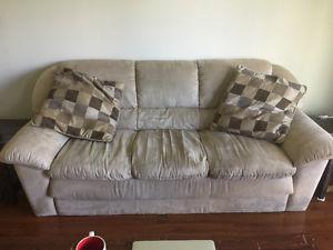 Beige Couch with Throw Pillows