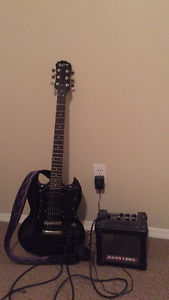 Electric Epiphone SG and micro cube amp