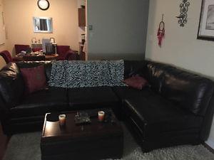 Espresso colored, leather like sectional couch and automan.