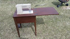 Old sewing machine with table and stool