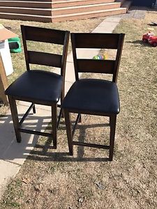 2 table chairs both in pretty good condition