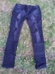 Black distressed and holed jeans