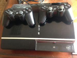 PS3 with 2 controllers, 2 games