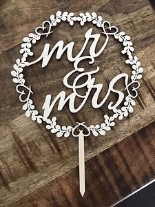 Beautiful wooden script "Mr. & Mrs." wedding cake topper
