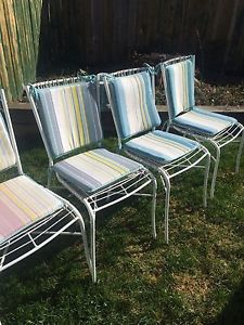 Four patio chairs with cushions -$40. OBO