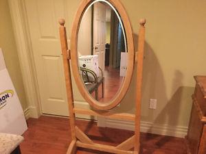 Oval pivoting mirror for sale.