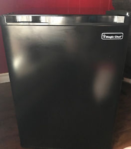 Selling black mini fridge.