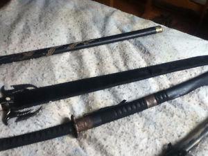 colection of swords and a bayonet