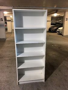 white bookcase, 6 feet high 24 inches wide