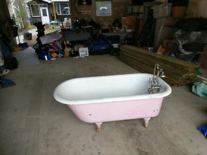 Antique Cast Iron Claw Foot Tub with antique faucet