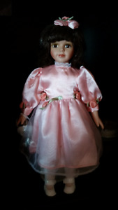 Avon Porcelain doll holding teacup