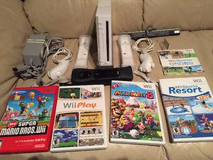 Nintendo Wii with numb chucks & extra remote / games