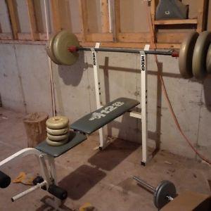 Weider bench with bar and weight