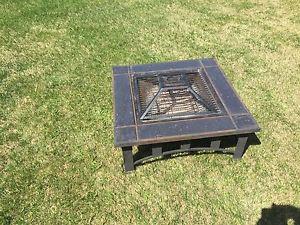 Wood burning patio fire table