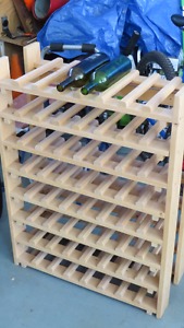 Wood wine rack holds 64 bottles