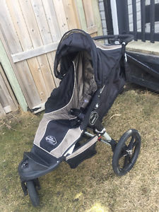 city jogger summit with hand breaks stroller and hitch hiker