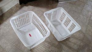 2 white laundry baskets