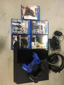 Playstation 4 with 5 games, 2 controllers and headset.