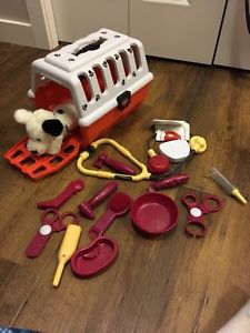 Toy vet kit and dog kennel