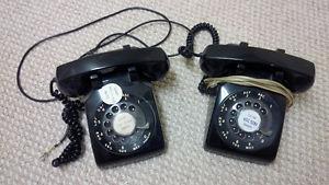 Two black rotary phones