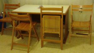 table or desk with 4 folding chairs
