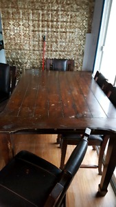 Large solid wood table and leather chairs