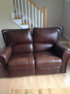 Brown leather love seat