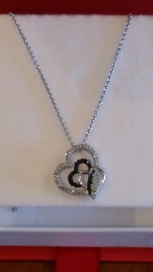Diamonds: Black and white. 30 ctw Triple Heart Necklace