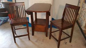 Double "Drop Leaf" Pub Table w/ Two Chairs. Three years old.