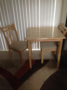 Light Coloured Wood Dining Room Table & 2 Chairs