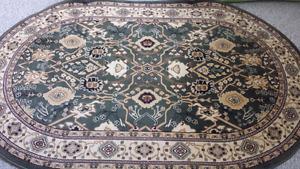 Oval green rug 150 cm × 230 cm
