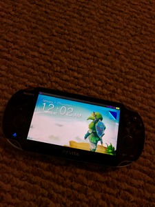 Ps Vita with games and memory cards