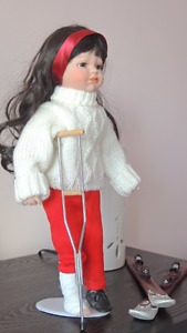 Skiing accident porcelain doll