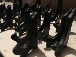 Variety of black wooden stands for plates etc