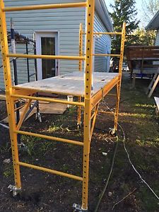 Yellow adjustable height scaffold