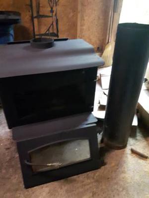 Wood Stove and piece of stove pipe