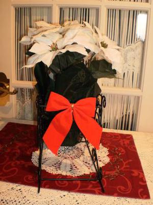 Faux Poinsettias in a Sleigh Planter