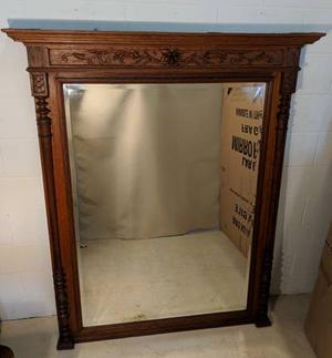 Highly carved solid oak framed mirror