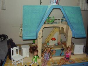 doll house and barbies and clothes and car