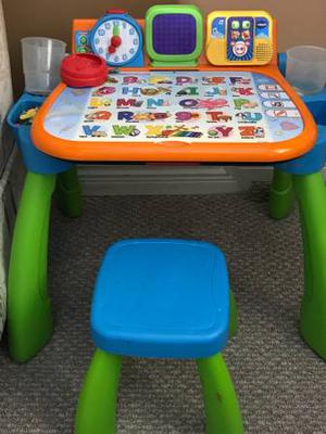Touch and learn activity table with a stool