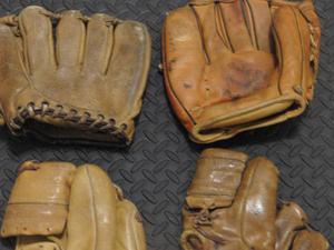 4 Old Vintage Baseball Gloves from 's