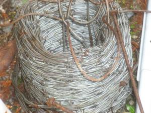 Roll of galvanized barbed wire