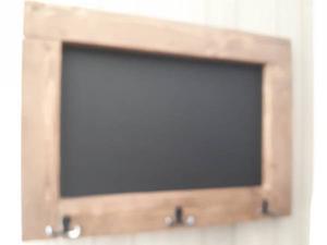 Rustic chalkboard with coat hooks