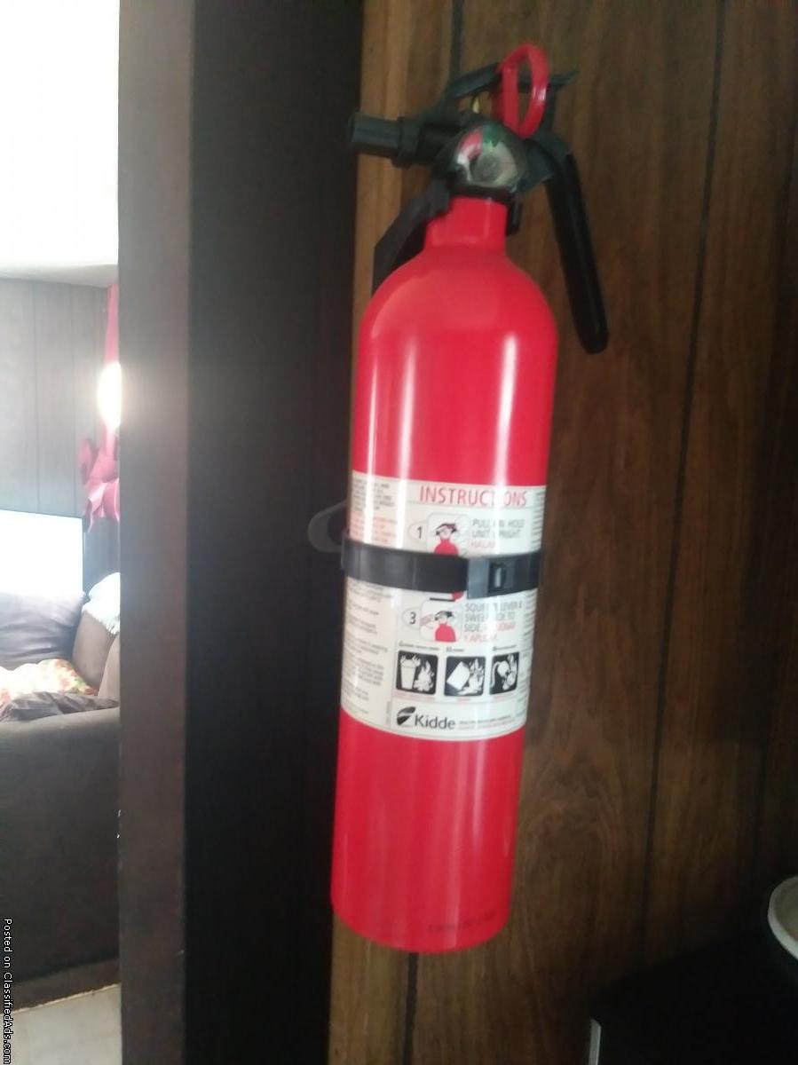 Fire extinguisher, wall mount.