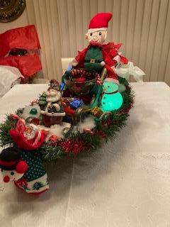Big elf in sleigh with santa stocking holder & goodies
